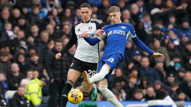 Chelsea's Cole Palmer, right, challenges for the ball with Fulham's Sasa Lukic during the English Premier League soccer match between Chelsea and Fulham at Stamford Bridge stadium in London, Saturday, Jan. 13, 2024. (Frank Augstein/AP) 