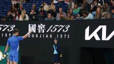 Djokovic challenges heckler in testy second-round win at Australian Open