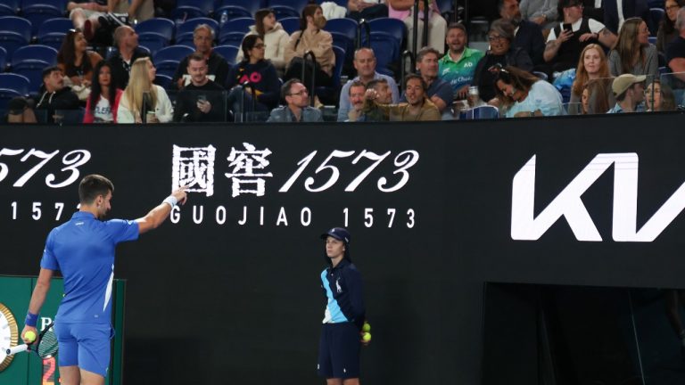 Novak Djokovic of Serbia points to a spectator during his second round match against Alexei Popyrin of Australia at the Australian Open tennis championships at Melbourne Park, Melbourne, Australia, Wednesday, Jan. 17, 2024. (AP)