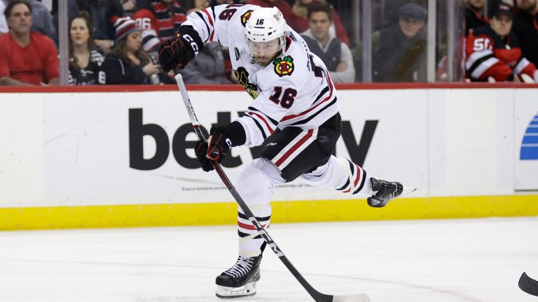 Chicago Blackhawks forward Jason Dickinson (16) in action against the New Jersey Devils during the third period of an NHL hockey game Friday, Jan. 5, 2024, in Newark, N.J. The Devils won 4-2. (Adam Hunger/AP) 