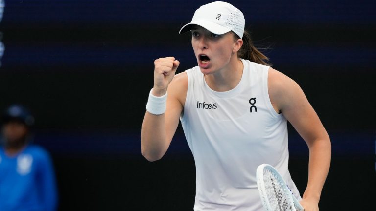 Poland's Iga Swiatek reacts after winning a point against Caroline Garcia of France during their United Cup semifinal tennis match in Sydney, Australia, Saturday, Jan. 6, 2024. (Mark Baker/AP)