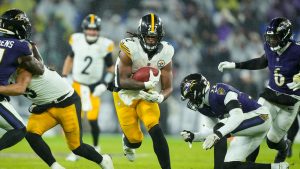 Pittsburgh Steelers running back Najee Harris runs with the ball against the Baltimore Ravens during the second half of an NFL game, Saturday, Jan. 6, 2024 in Baltimore. (Matt Rourke/AP)