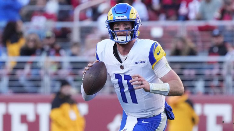 Los Angeles Rams quarterback Carson Wentz (11) passes against the San Francisco 49ers during the second half of an NFL football game in Santa Clara, Calif., Sunday, Jan. 7, 2024. (Loren Elliott/AP)