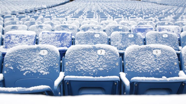 Seats are dusted with snow prior to an NFL wild-card playoff football game between the Buffalo Bills and the Miami Dolphins, Sunday, Jan. 15, 2023, in Orchard Park, N.Y. (Joshua Bessex/AP) 