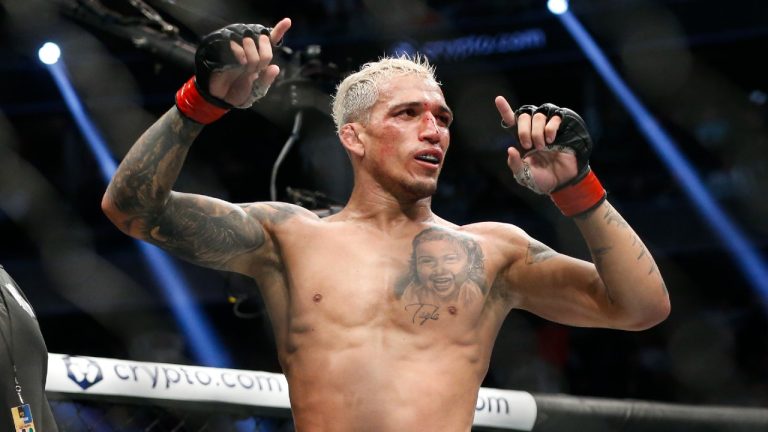 Charles Oliveira reacts after defeating Dustin Poirier by submission in a lightweight mixed martial arts title bout at UFC 269, Saturday, Dec. 11, 2021, in Las Vegas. A lightweight bout between former champion Oliveira and Beneil Dariush has been confirmed as the co-main event of UFC 289 in Vancouver. (Chase Stevens/AP)