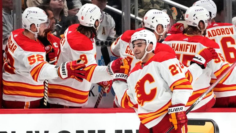 Calgary Flames' Matt Coronato is congratulated for his goal against the Pittsburgh Penguins during the second period of an NHL hockey game in Pittsburgh, Saturday, Oct. 14, 2023. (Gene J. Puskar/AP Photo)