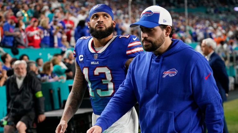 Buffalo Bills wide receiver Gabe Davis is escorted off the field during the first half of an NFL football game against the Miami Dolphins, Sunday, Jan. 7, 2024, in Miami Gardens, Fla. (Lynne Sladky/AP Photo)