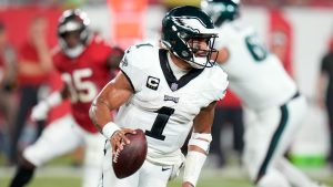 Philadelphia Eagles' Jalen Hurts runs during the second half of an NFL football game. (Chris O'Meara/AP)