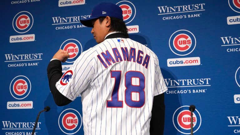 New Chicago Cubs pitcher Shōta Imanaga poses with his jersey during a news conference Friday, Jan. 12, 2024, in Chicago. The Japanese left-hander is expected to step right into the baseball team's rotation as it tries to return to the playoffs for the first time since 2020. (Nam Y. Huh/AP)