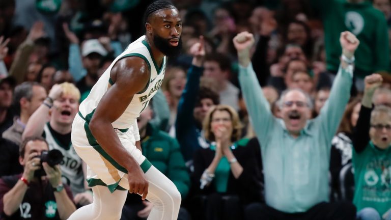 Fans react after a 3-pointer by Boston Celtics' Jaylen Brown (7) during the first half of an NBA basketball game, Friday, Dec. 29, 2023, in Boston. (AP Photo/Michael Dwyer)