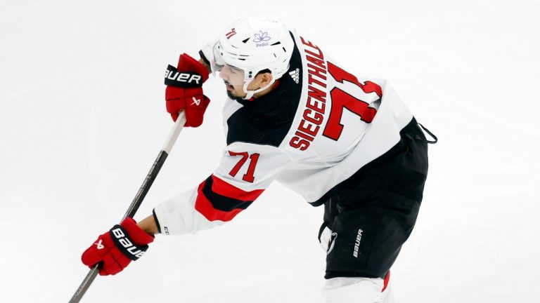 New Jersey Devils defenceman Jonas Siegenthaler broke his foot in Saturday's game versus the Canucks. (AP/Michael Dwyer)