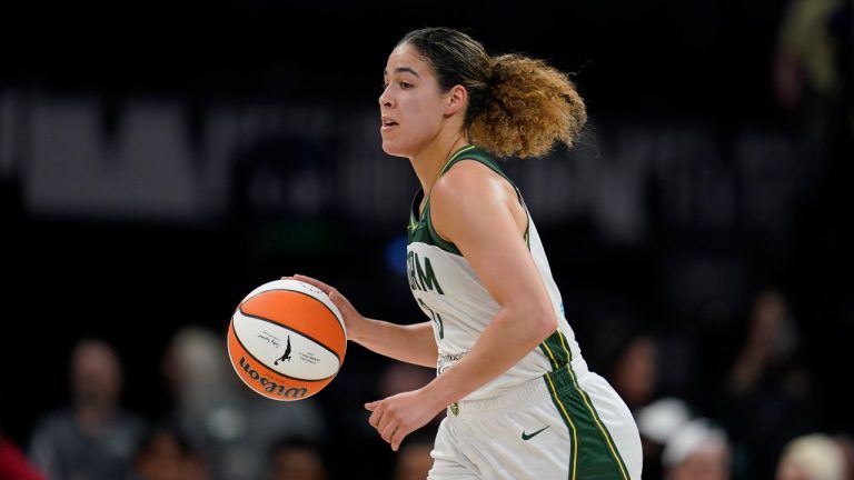 Seattle Storm guard Kia Nurse dribbles down the court during the first half of a WNBA basketball game against the Minnesota Lynx, Tuesday, June 27, 2023, in Minneapolis. (AP Photo/Abbie Parr)