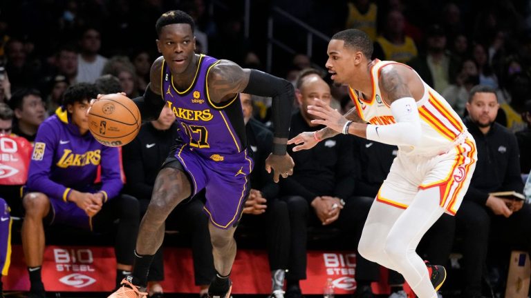 Los Angeles Lakers' Dennis Schroder drives past Atlanta Hawks' Dejounte Murray during first half of an NBA basketball game Friday, Jan. 6, 2023, in Los Angeles. (Jae C. Hong/AP Photo)