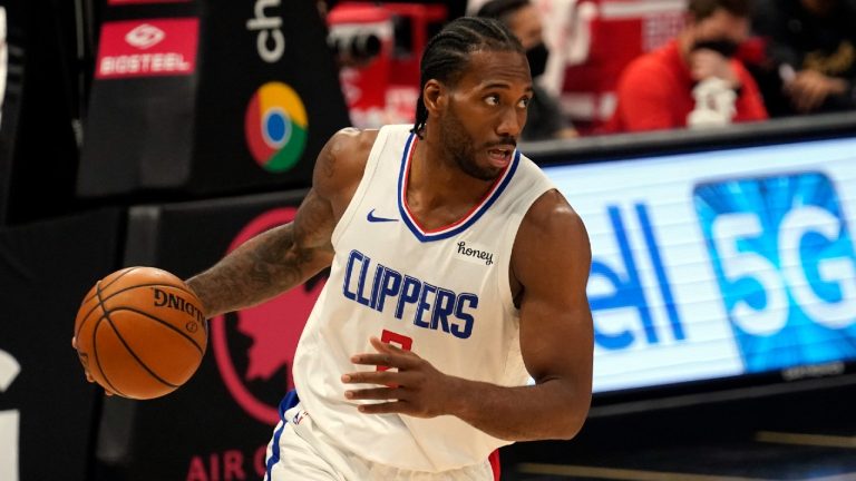 FILE - In this May 11, 2021, file photo, Los Angeles Clippers forward Kawhi Leonard (2) dribbles during the first half of an NBA basketball game against the Toronto Raptors in Tampa, Fla. (Chris O'Meara/AP)