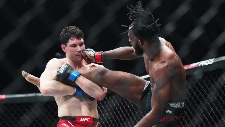 Mike Malott, left, fights Neil Magny during a welterweight bout at UFC 297 in Toronto. (Nathan Denette/CP)