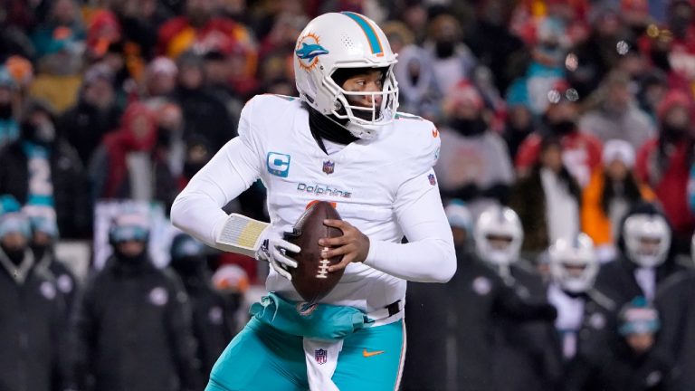 Miami Dolphins quarterback Tua Tagovailoa rolls out to pass against the Kansas City Chiefs during the first half of an NFL wild-card playoff football game Saturday, Jan. 13, 2024, in Kansas City, Mo. (Ed Zurga/AP)