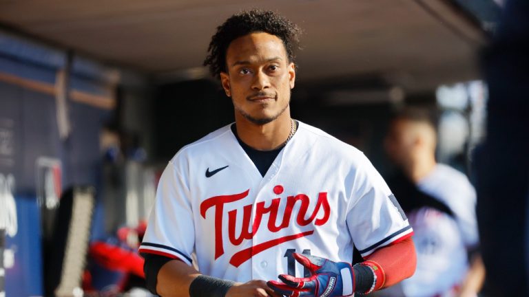 Minnesota Twins' Jorge Polanco walks in the dugout after striking out in the third inning of Game 3 of an American League Division Series baseball game against the Houston Astros, Tuesday, Oct. 10, 2023, in Minneapolis. (Bruce Kluckhorn/AP)