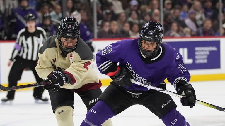 Minnesota forward Brittyn Fleming (18) skates with the puck as Montreal defender Mariah Keopple (2) challenges during the first period of a PWHL hockey game Saturday, Jan. 6, 2024, in St. Paul, Minn. (AP/Abbie Parr)