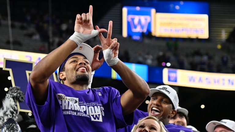 Washington wide receiver Rome Odunze, left, celebrates after the team defeated Oregon in the Pac-12 championship NCAA college football game Friday, Dec. 1, 2023, in Las Vegas. (AP Photo/David Becker)