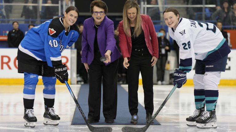 PWHL board member Billie Jean King (centre left)and PWHL executive Jayna Hefford drop pucks between Toronto captain Blayre Turnbull (left) and New York captain Micah Zandee-Hart (right) for the ceremonial faceoff before the inaugural PWHL game in Toronto on Monday, Jan.1, 2024. (Frank Gunn/CP)