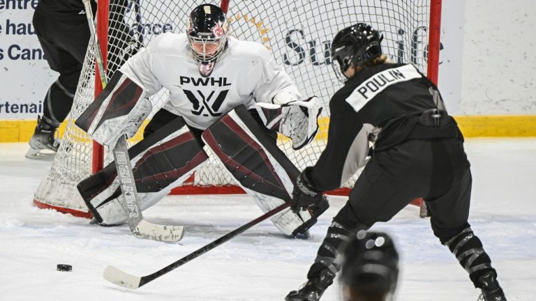 Montreal's Marie-Philip Poulin moves in on goaltender Ann-Renee Desbiens during the Professional Women's Hockey League’s (PWHL) training camp in Montreal, Saturday, November 18, 2023. THE CANADIAN PRESS/Graham Hughes