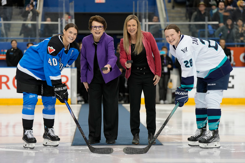 New York captain, Micah Zandee-Hart (far right), prepares for the ceremonial faceoff ahead of the PWHL's first ever game alongside (left to right) Blayre Turnbull, Billie Jean King and Jayna Hefford. (Photo by Frank Gunn/CP)