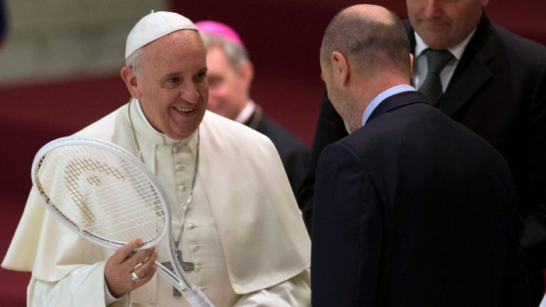 Pope Francis is presented with a tennis racket by the President of the Italian Tennis Federation Angelo Binaghi, right, during an audience with athletes in the Paul VI hall at the Vatican, Friday, May 8, 2015. Pope Francis congratulated Italy on Monday, Jan. 29, 2024, after tennis player Jannik Sinner became the country's first man to win a Grand Slam singles title, the Australian Open, in nearly a half century. (Alessandra Tarantino/AP)