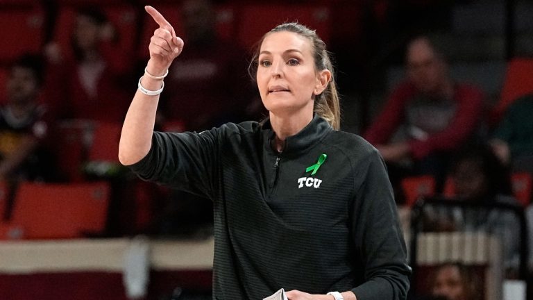 TCU head coach Raegan Pebley gestures in the second half of an NCAA college basketball game against Oklahoma, Tuesday, Jan. 31, 2023, in Norman, Okla. (AP Photo/Sue Ogrocki)