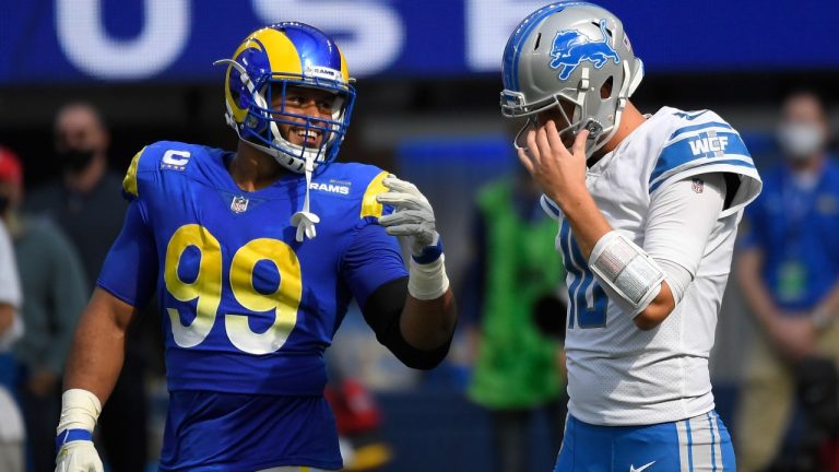 Detroit Lions quarterback Jared Goff, right, talks with Los Angeles Rams defensive end Aaron Donald during the first half of an NFL football game Sunday, Oct. 24, 2021, in Inglewood, Calif. (Kevork Djansezian/AP)