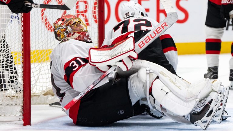 Ottawa Senators goaltender Anton Forsberg (31) sits on the ice after Vancouver Canucks Elias Pettersson’s (40) goal during the first period of an NHL hockey game. (Ethan Cairns/CP)