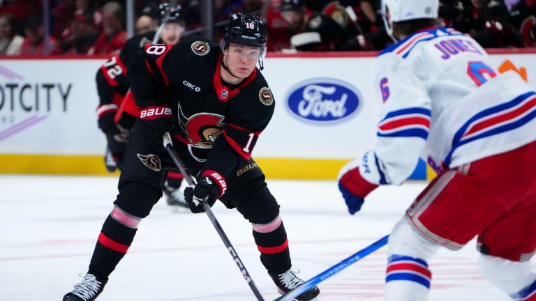 Ottawa Senators centre Tim Stutzle (18) skates the puck up the ice while taking on the New York Rangers during first period NHL hockey action in Ottawa on Saturday, Jan. 27, 2024. (Sean Kilpatrick/CP)