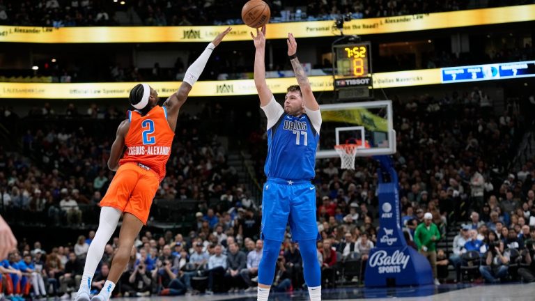 Dallas Mavericks guard Luka Doncic (77) shoots against Oklahoma City Thunder guard Shai Gilgeous-Alexander (2) during the first half of an NBA basketball game in Dallas, Saturday, Dec. 2, 2023. (AP Photo/LM Otero)