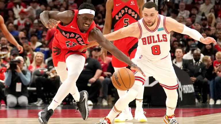 Toronto Raptors' Pascal Siakam (43) and Chicago Bulls' Zach LaVine battle for a loose ball during the first half of an NBA basketball game. (Charles Rex Arbogast/AP)