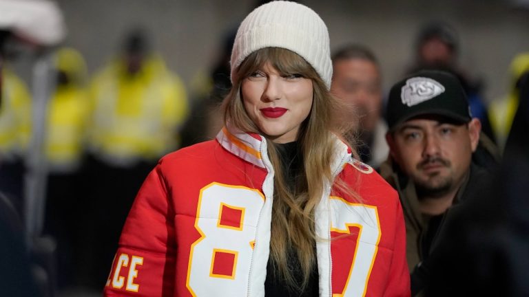 Taylor Swift wears a Kansas City Chiefs tight end Travis Kelce jacket as she arrives before an NFL wild-card playoff football game between the Chiefs and the Miami Dolphins Saturday, Jan. 13, 2024, in Kansas City, Mo. (Ed Zurga/AP)