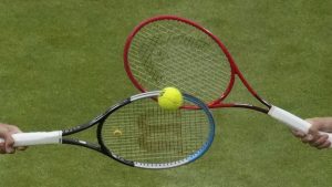 Two tennis rackets and a ball.(Alberto Pezzali/CP/AP)