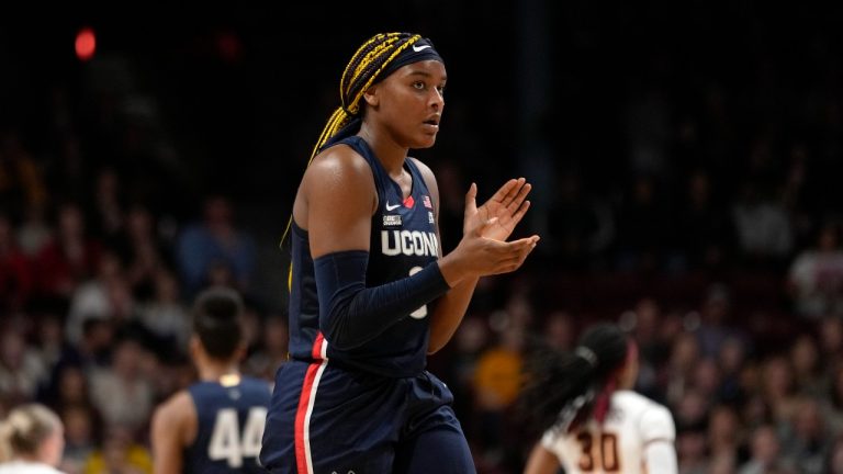 UConn forward Aaliyah Edwards claps during the first half of an NCAA college basketball game against Minnesota, Sunday, Nov. 19, 2023, in Minneapolis. (Abbie Parr/AP Photo)