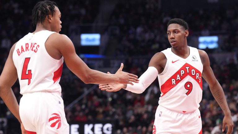 Toronto Raptors' RJ Barrett is congratulated by teammate Scottie Barnes (4) during second half NBA basketball action against the Cleveland Cavaliers, in Toronto, Monday, Jan. 1, 2024. (Chris Young/CP)