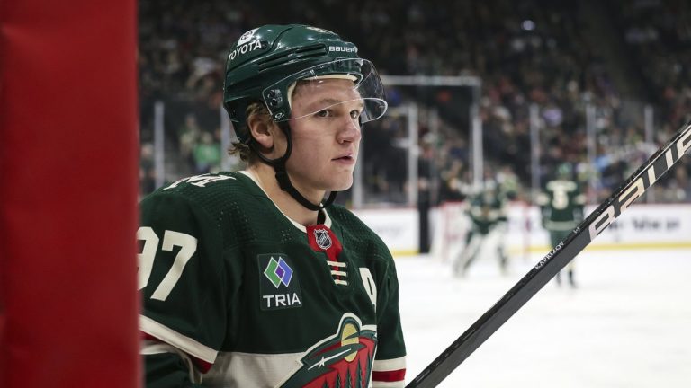 Minnesota Wild left wing Kirill Kaprizov watches from the bench during the first period of an NHL hockey game against the New York Islanders, Monday, Jan. 15, 2024, in St. Paul, Minn. Kaprizov, Boston right-wing David Pastrnak and Vegas goaltender Logan Thompson have been named the NHL’s three stars of the week. (Stacy Bengs/AP)