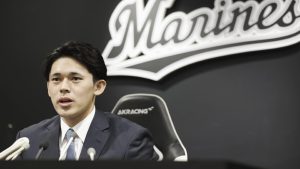 Japan's Lotte Marines pitcher Roki Sasaki speaks at a press conference in Chiba, near Tokyo Saturday, Jan. 27, 2024, after he signed a contract for the coming season with the team. (Kyodo News via AP)