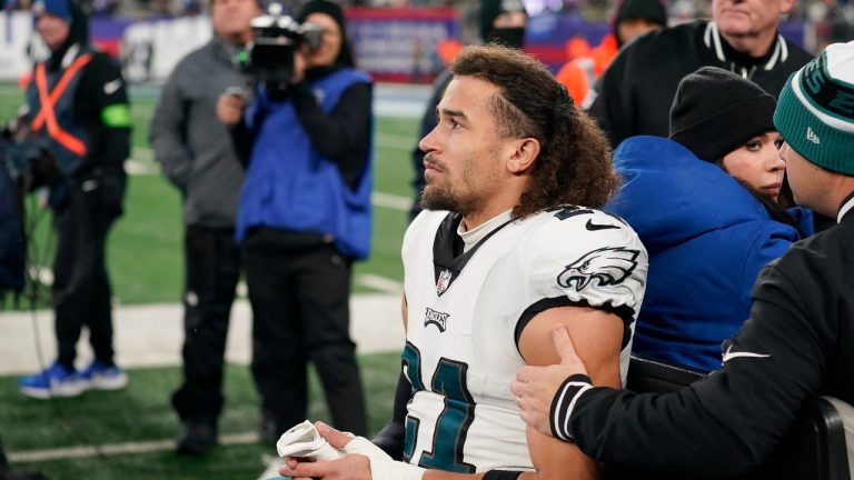 Philadelphia Eagles safety Sydney Brown (21) leaves the field with an injury during the first half of an NFL football game against the New York Giants, Sunday, Jan. 7, 2024, in East Rutherford, N.J. (Seth Wenig/AP Sports)