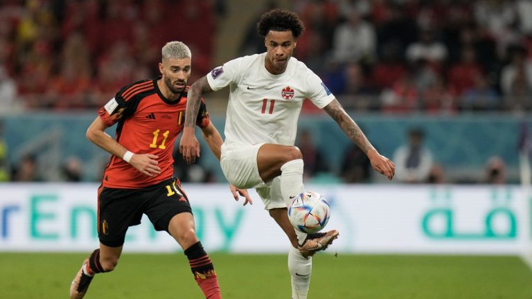 Canada's Tajon Buchanan, right, controls the ball ahead of Belgium's Yannick Carrasco during the World Cup group F soccer match between Belgium and Canada, at the Ahmad Bin Ali Stadium in Doha, Qatar, Wednesday, Nov. 23, 2022. (Hassan Ammar/AP)