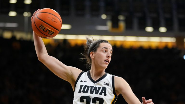 Iowa guard Caitlin Clark (22) grabs a rebound during the first half of an NCAA college basketball game against Nebraska, Saturday, Jan. 27, 2024, in Iowa City, Iowa. (Charlie Neibergall/AP Photo)