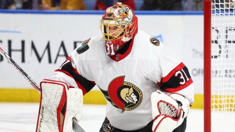 Ottawa Senators goaltender Anton Forsberg (31) makes a blocker save during the first period of the team's NHL hockey game against the Buffalo Sabres on Thursday, Jan. 11, 2024, in Buffalo, N.Y. (Jeffrey T. Barnes/AP)