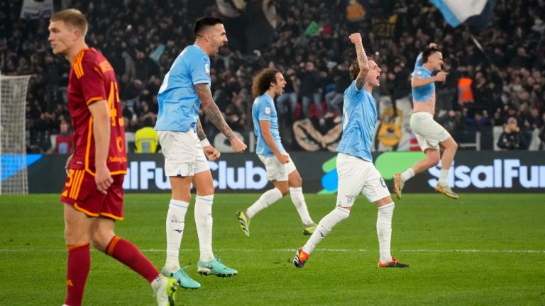 Lazio players celebrate at the end of the quarterfinal Italian Cup soccer match between Lazio and Roma at Rome's Olympic Stadium, Wednesday, Jan. 10, 2024. (Gregorio Borgia/AP)