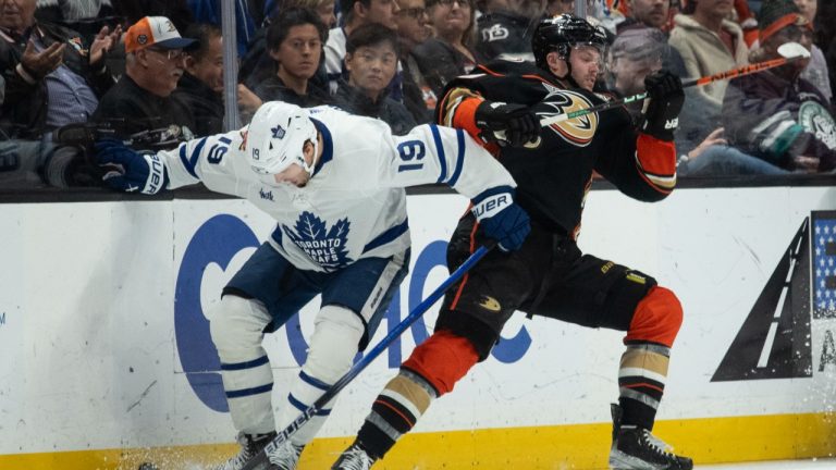 Toronto Maple Leafs center Calle Jarnkrok (19) wins the puck away from Anaheim Ducks left wing Max Jones (49) during the second period of an NHL hockey game Wednesday, Jan. 3, 2024, in Anaheim, Calif. (Kyusung Gong/AP Photo)