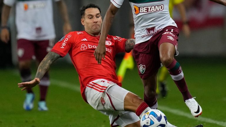 Hugo Mallo of Brazil's Internacional battles for the ball during a Copa Libertadores semifinal second leg soccer match at Beira Rio stadium in Porto Alegre, Brazil, Wednesday, Oct. 4, 2023. Soccer player Hugo Mallo will go on trial on an accusation he inappropriately touched a mascot before a Spanish league game in 2019, court officials said Wednesday. Mallo, who denies wrongdoing, was with Celta Vigo when the alleged incident happened before a first-division match against Espanyol. The 32-year-old Spanish player currently plays for Brazilian club Internacional. (Andre Penner/AP Photo)