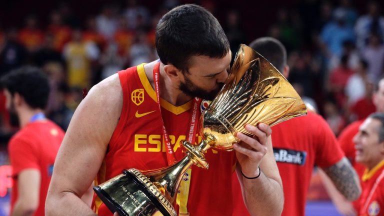 Marc Gasol of Spain celebrates with the Naismith Trophy after they beat Argentina in their first-place match in the FIBA Basketball World Cup at the Cadillac Arena in Beijing, Sunday, Sept. 15, 2019. (AP Photo/Mark Schiefelbein)