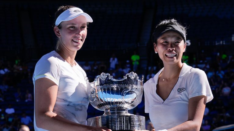 Hsieh Su-Wei, right, of Taiwan and Elise Mertens of Belgium pose with their trophy after defeating Jelena Ostapenko of Latvia and Lyudmyla Kichenok of Ukraine in the women's doubles final at the Australian Open tennis championships at Melbourne Park, in Melbourne, Australia, Sunday, Jan. 28, 2024. (Andy Wong/AP)