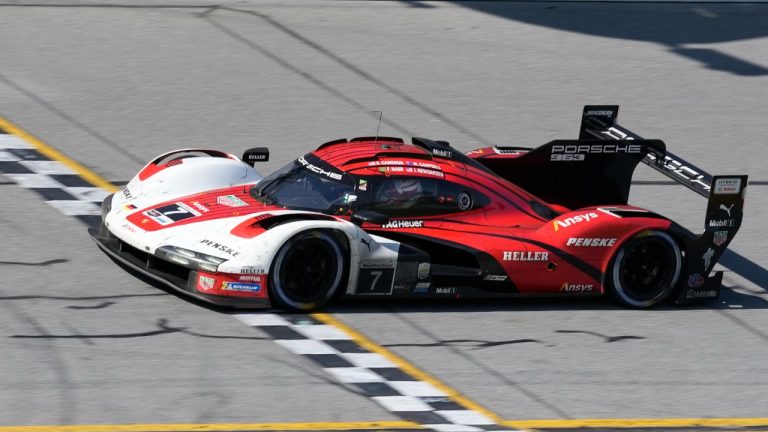 Filipe Nasr crosses the finish line in a Porsche 963 for the Porsche Penske Motorsport team to win the Rolex 24 hour auto race at Daytona International Speedway, Sunday, Jan. 28, 2024, in Daytona Beach, Fla. (John Raoux/AP)