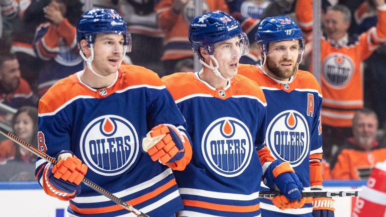 Edmonton Oilers' Zach Hyman (18), Ryan Nugent-Hopkins (93) and Leon Draisaitl (29) celebrate a goal against the Philadelphia Flyers during second period NHL action in Edmonton, Tuesday, Jan. 2, 2024. (Jason Franson/THE CANADIAN PRESS)